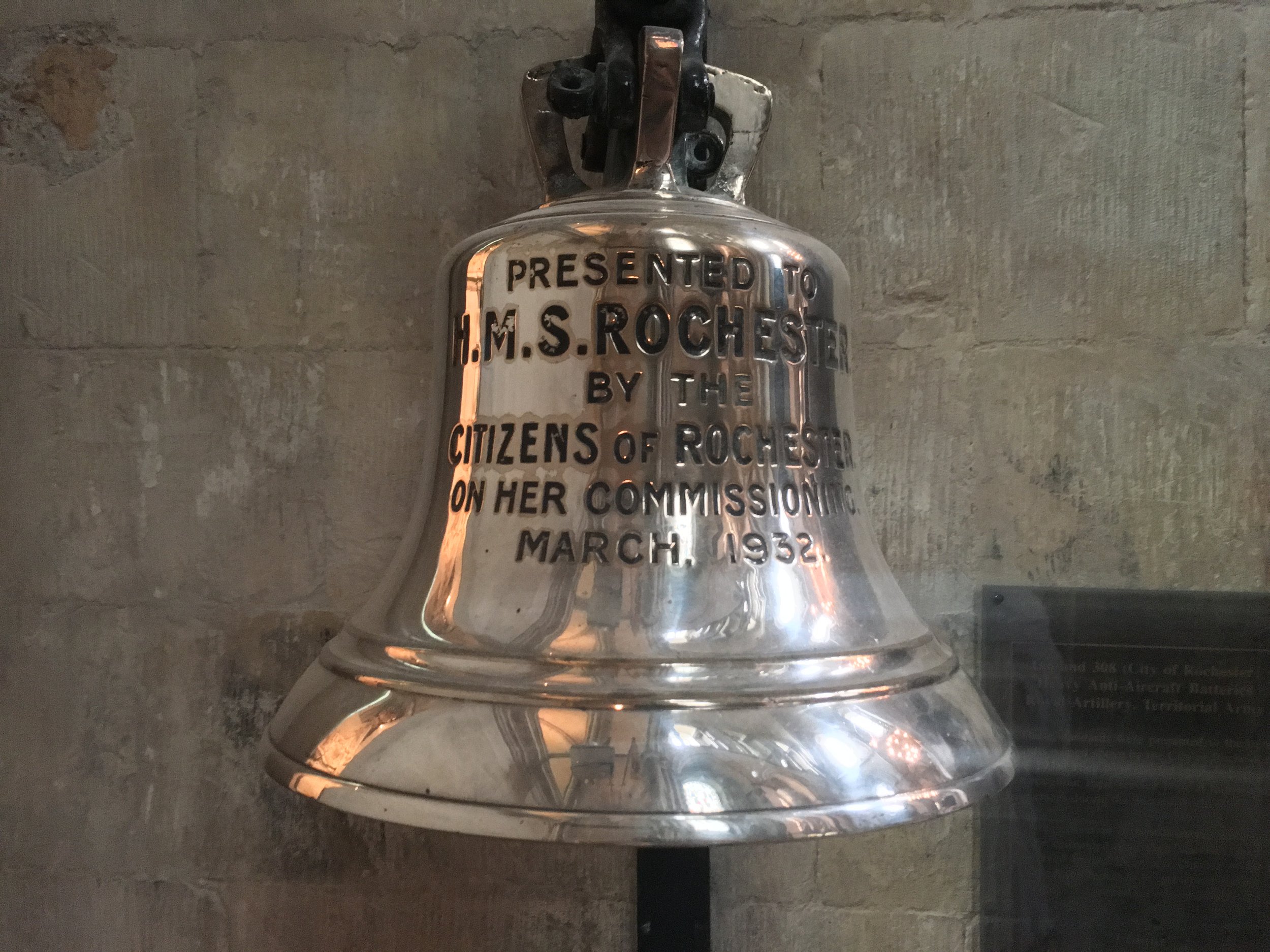 Photograph of the ships bell of HMS Kent in the North Quire Transept.