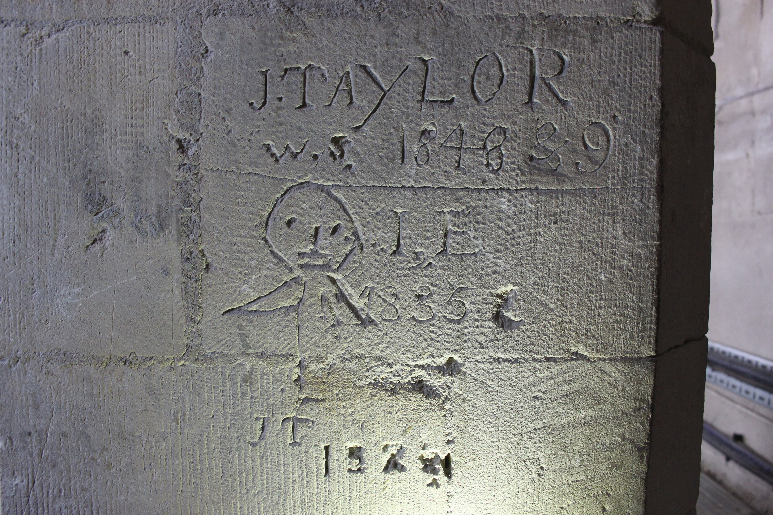 Photograph of a graffito on a pier in the north nave transept clerestory.