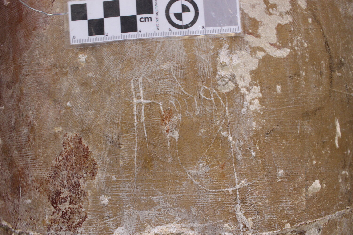 Photograph of an inscribed graffito on a pier in the south nave arcade.