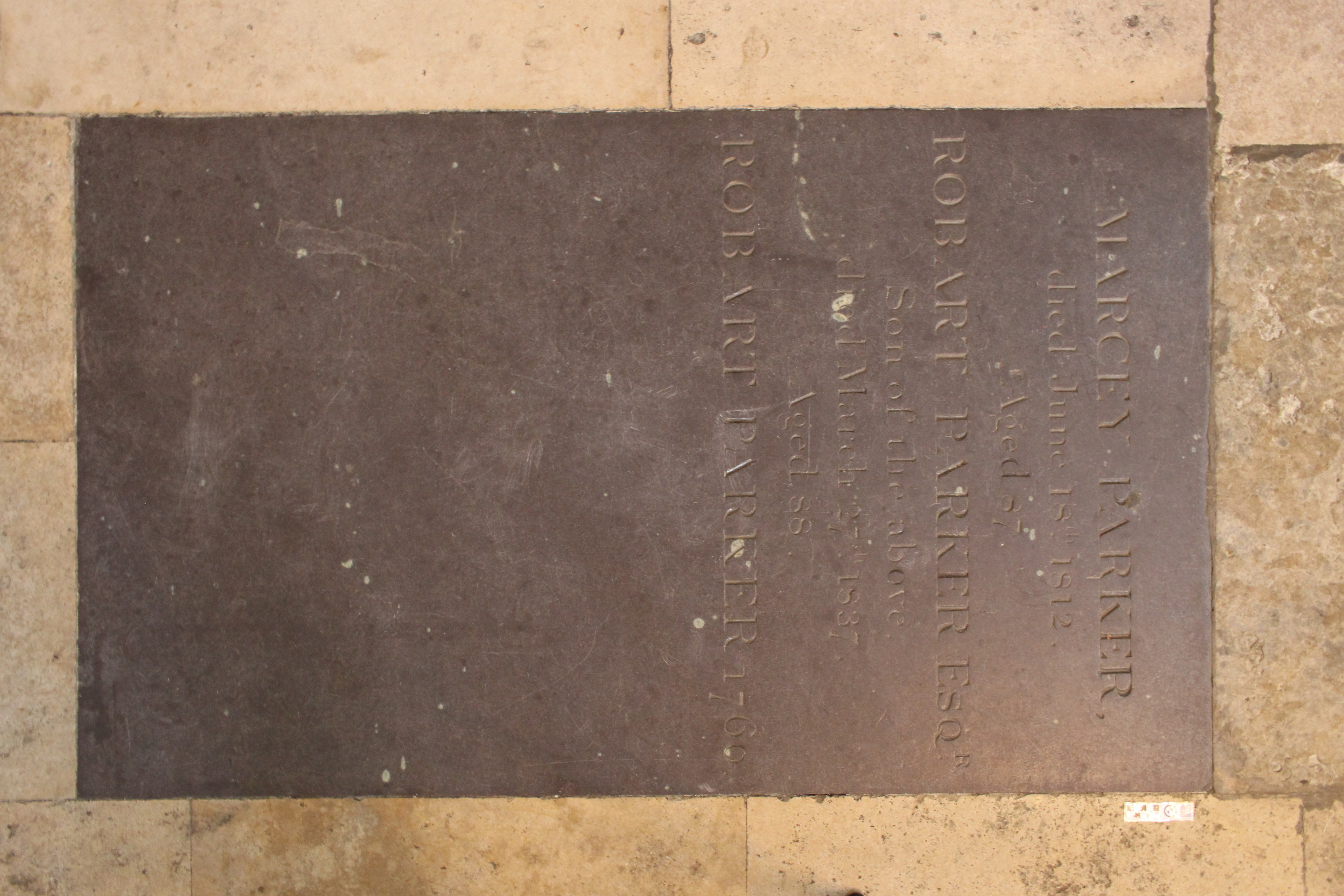 Photograph of the ledger stone dedicated to Marcey, Robart (snr) and Robart (jnr) Parker in the south nave transept.