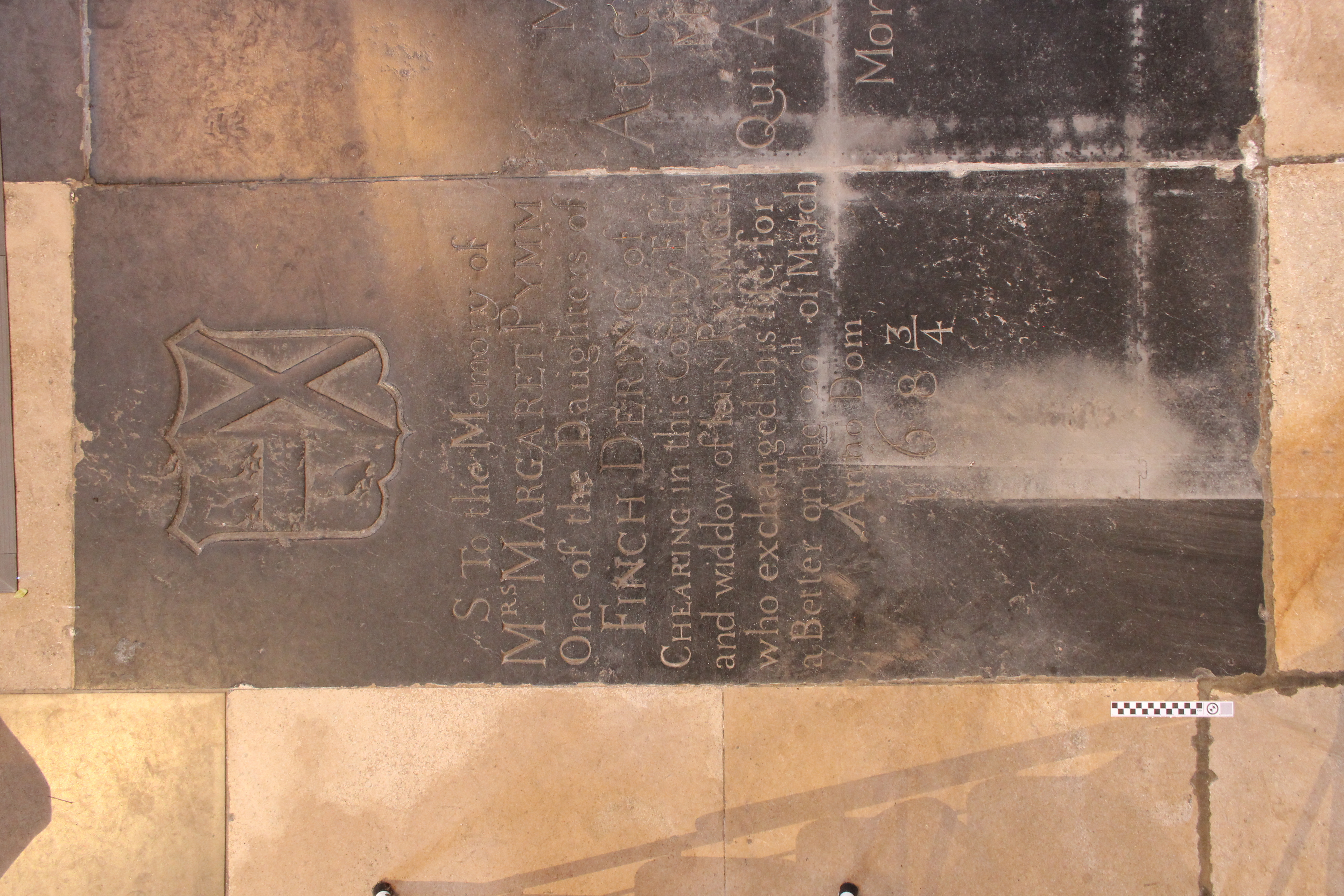 Photograph of the ledger stone dedicated to Margaret Pymm in the north nave transept.